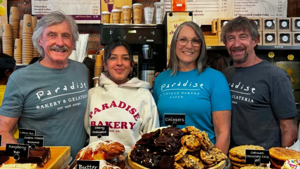 Paradise Bakery founders Danny and Mark Patterson with two team members behind the counter in Aspen