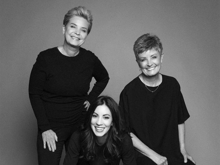 Matter Planning + Design founder Noelle Hernandez and daughter Nicole with a colleague, black and white studio portrait