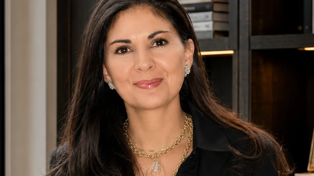 Soffia Wardy, global luxury real estate advisor in Aspen, smiling in a black blouse