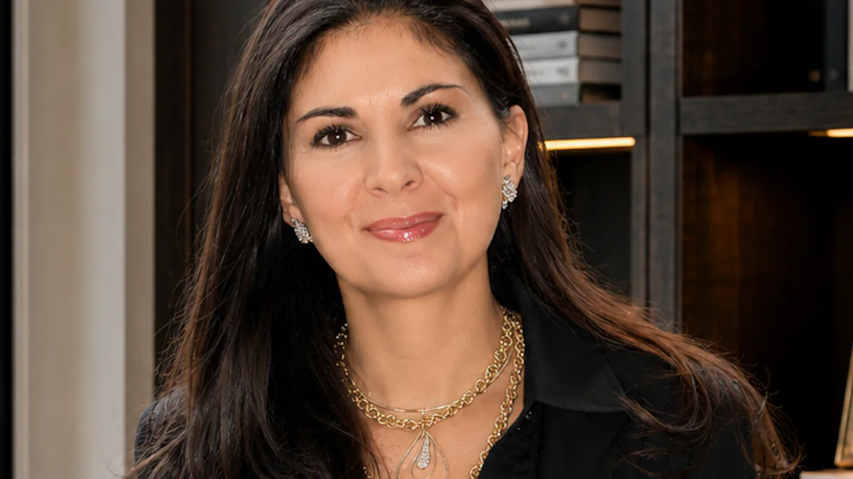 Soffia Wardy, global luxury real estate advisor in Aspen, smiling in a black blouse