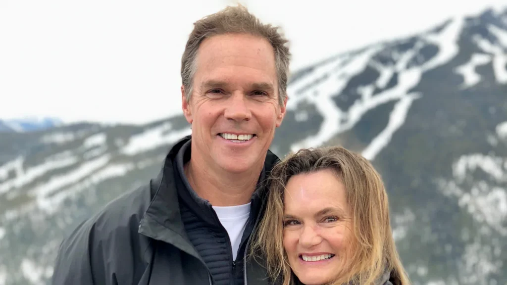 Jaywalker Lodge founder Bob Ferguson with his wife, Andy, in front of a snowy ski mountain