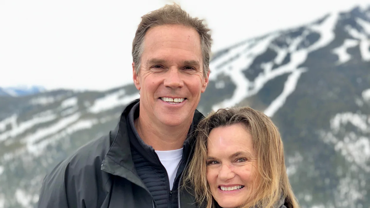 Jaywalker Lodge founder Bob Ferguson with his wife, Andy, in front of a snowy ski mountain